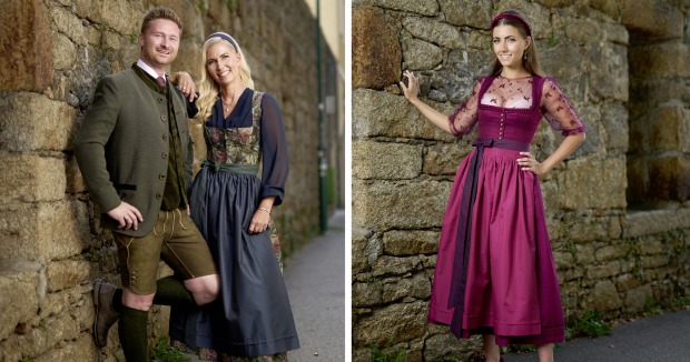 Dirndl mit floralem Muster, Jacquard und Tüllbluse sowie Herren-Tracht mit Stehkragenjacke und Lederhose.