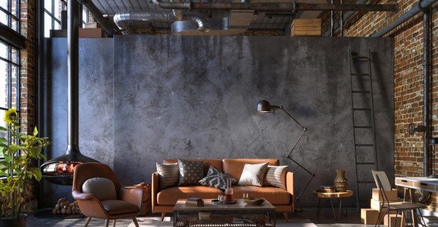 Wohnzimmer mit Rohren an den Wänden und ein Ledersofa steht im Raum | Credit: iStock.com/Vasyl Cheipesh